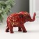 Souvenir Polystone "Elephant in the Golden Popone with Red Stone" 7.5x3x5 cm