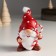 Polystone souvenir "Santa Claus in a red cap in white peas, with a candy" 6x6.5x10 cm