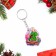 A keychain "Happy New Year!" symbol of the year, Christmas tree