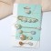 A set of pins (6 pcs.) “Pearl Assorted”, 6.5 cm, white color in gold