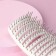 The comb is massage, with a magnet, rubberized handle, ventilated, 7.5 × 25.5 cm, beige/white color