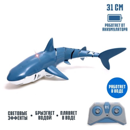 The radio -controlled “white” shark swims, splashes water, works from the battery, the color is blue