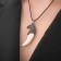 Unisex “Claw Eagle”, white color in silver on a black lace, 45 cm