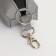 Key of zipper, length 16 cm, ring, carbine, gray color