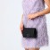 Female bag on a magnet, black color