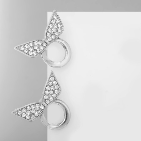 Earrings with Rhinestes "Bow" on the ring, white color in silver-1