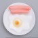 Toy squeezing "breakfast" for dogs, 13.5 cm, on a white plate