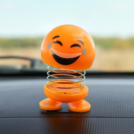 Smile on the spring, on the panel in the car, laughter, yellow