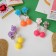 Clips children's "chosen" roses with beads, color mix