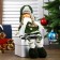 Interior doll "Girl with pigtails in a green coat and green hat" 36x8x13 cm