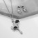Set 2 objects: earrings, pendant "melting" heart, black and white color in silver, 40 cm