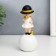 Polystone souvenir "Baby in a black hat, with a gold bubble on the ball" 15x7x7 cm