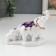 Souvenir ceramics "Elephant with elephants" white with gold, rhinestones 16.2 cm