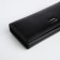 Women's wallet on a magnet, black color