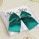 Smith's rings pillow, white with a green bow