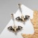 Emall Earrings "Bat", black color in gold