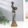 Polystone souvenir "African with a jug, in a dress with silver flowers" mix 25.5x7x5 cm