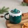 Ceramic mug with silicone lid of the Santa Claus, 380 ml, green color