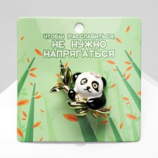 Panda brooch on a branch, colored in gold