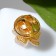 Clover icon is four -leafed, beige color in gold