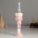 Polystone souvenir "Nutcracker in a pink uniform, with a gift" 4.5x4.5x21 cm