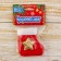Soft suspension "Nosok - Golden Star" 8x6 cm, red