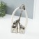 Souvenir Ceramics "Family Elephants. Oval" White with silver 6.5x17x28.5 cm