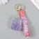 A plastic keychain with a carbine, a strap of "backpack" water with decor1.8x5.3x5.6 cm