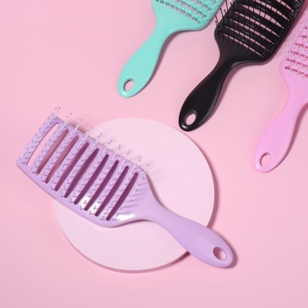 The comb is massage, wide, ventilated, 7.5 × 23 cm, color mix