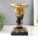 Souvenir Polystone stand "African in a golden device, with earrings in the ears" 25x15x15 cm