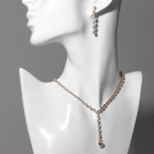 Set 2 objects: earrings, necklace “ice” Simple, white color in gold