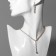 Set 2 objects: earrings, necklace “ice” Simple, white color in gold