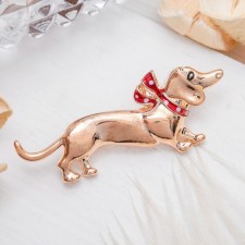 Diagon's dachshund broch with a bow, red color in gold
