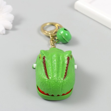 A plastic keychain with a carbine "dinosaurus-zubastik" closes when a tooth is pressed 5x7.5x4.5 cm 1049898-2