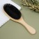 Comb with bristles, 22 × 7 cm, beige color/black