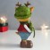 Souvenir Polystone "Olenien in a green hat with a Christmas tree" 8.5x8x18.3 cm