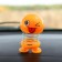 Smile on the spring, on the panel in the car, winks, yellow
