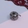 Bobbin cap to BSHM, left, 3 × 2.5 × 1.5 cm