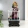 Polystone souvenir "Zebra with a glass in an armchair" 25x12x15 cm