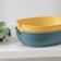 The soap dish is oval, plastic, 15 × 11 × 4 cm, color mix