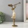 Polystone souvenir "Girl plays on the pipe, with a bird" Sand with bronze 19x6.5x27.5 cm