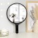 Mirror with a handle, D mirror surface 24 cm, black color