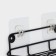 A holder for toilet paper with a shelf, 19 × 10 × 14.5 cm, black color