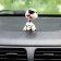 Dog on a car panel shocking his head, Dalmatian