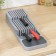A tray for knives and cutlery Harm, the color is gray