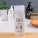 The bottle with the pump "Love What You Do", 150 ml, black/white color