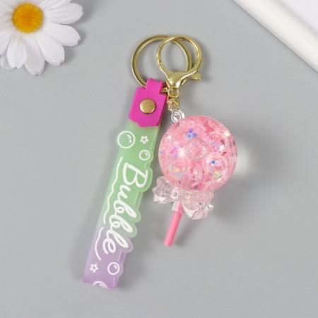 A keychain plastic with a carbine, a strap "Lollipop with a bow" Water with a glitter of 4x4x6.5 cm-1
