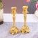 A set of 2 candlesticks, 7 x 7 x 19 cm
