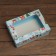 The box is folding, the lid is, with the “New Year's gift” window 24 x 17 x 8 cm
