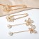 Set of pins (4 pcs.) "Flowers", 8 cm, white color in gold